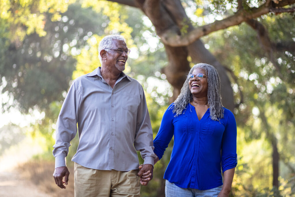 Senior African American Couple Walking on a Nature Trail
